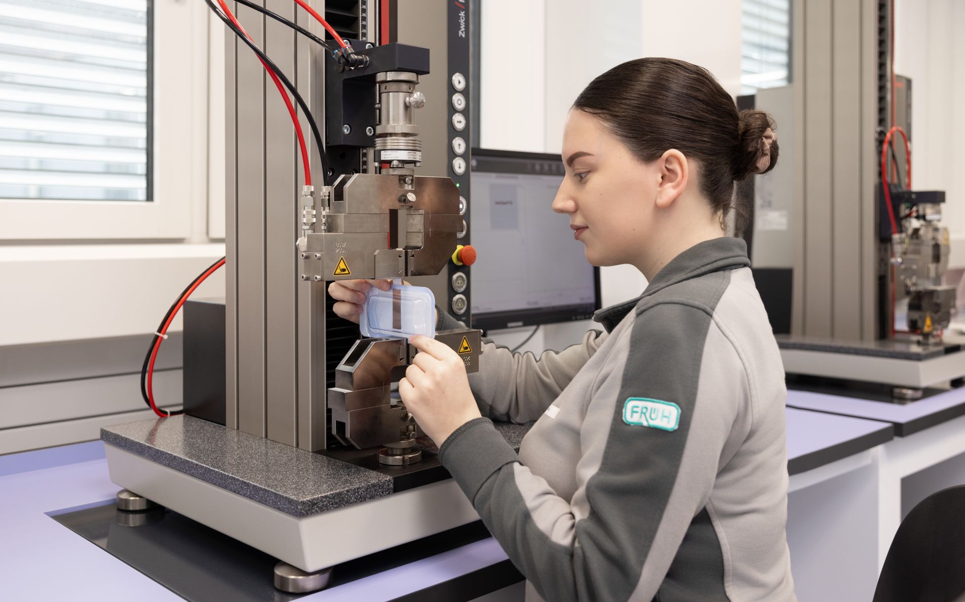 Woman controls test on Zwick Machine