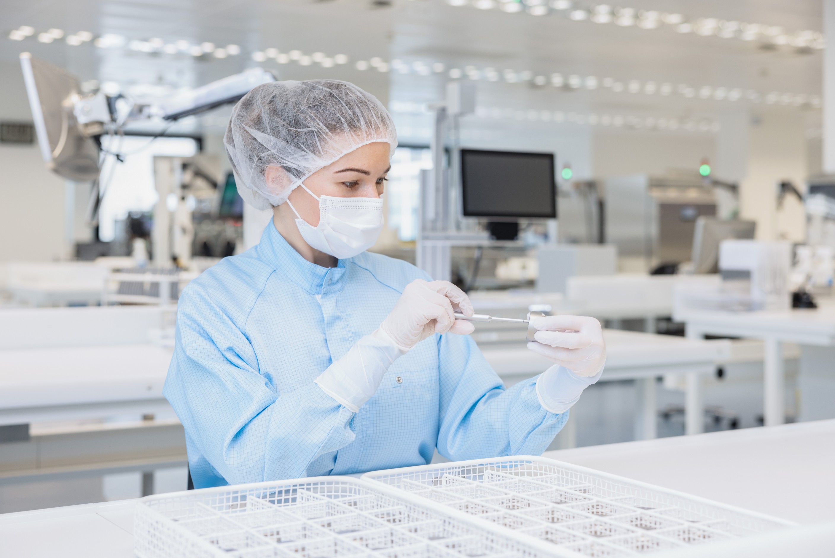 woman assembling implant
